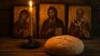 Drveni sto sa svećom, hlebom i pravoslavnim ikonama u pozadini, prikazuje tradicionalni srpski ritual za Usekovanije.